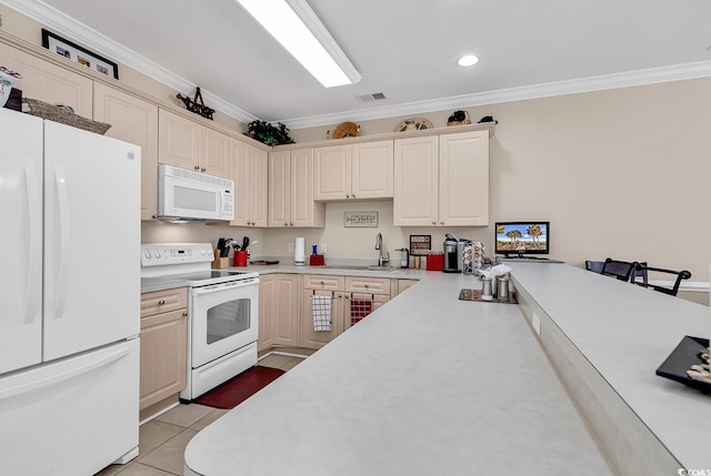 kitchen featuring sink, light tile patterned floors, crown molding, white appliances, and cream cabinetry