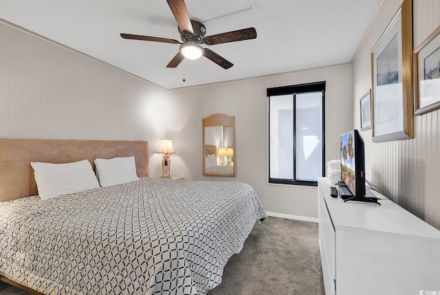 bedroom featuring carpet flooring, a textured ceiling, and ceiling fan