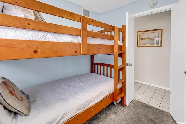 bedroom featuring light tile patterned floors