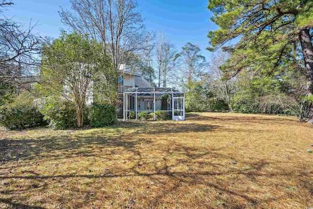 view of yard featuring a lanai