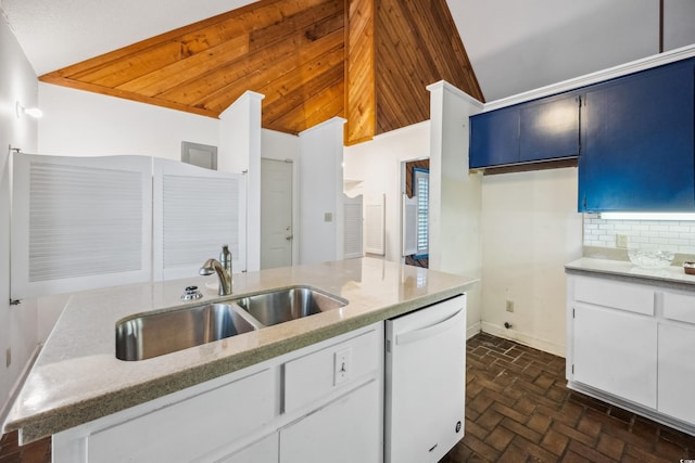 kitchen featuring decorative backsplash, sink, blue cabinetry, dishwasher, and lofted ceiling