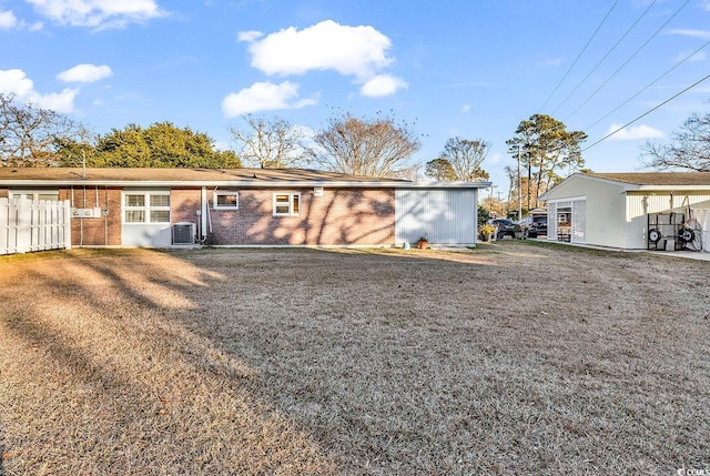 rear view of property with cooling unit