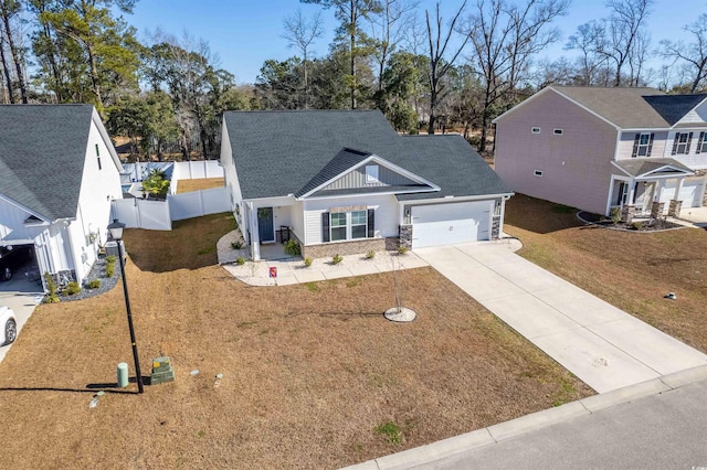 view of front of property with a front yard and a garage