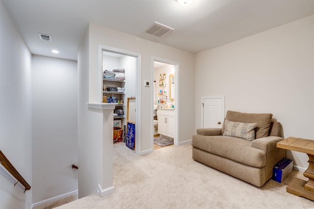 living area with light colored carpet