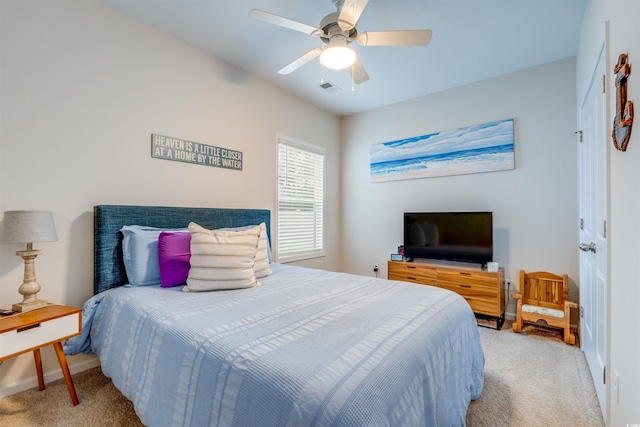 bedroom featuring ceiling fan and light carpet