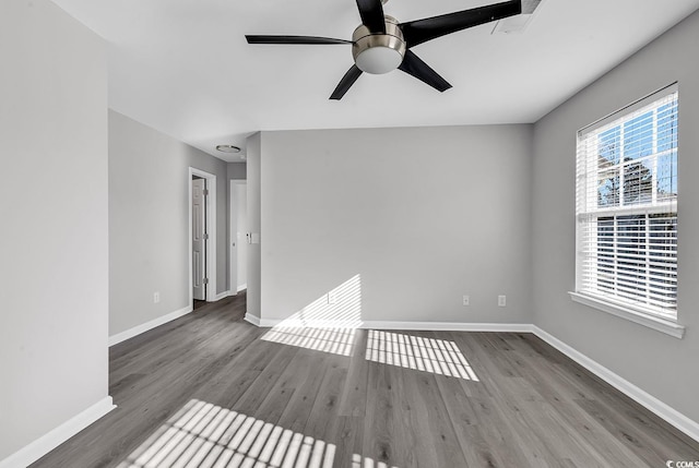 unfurnished room with hardwood / wood-style floors and ceiling fan