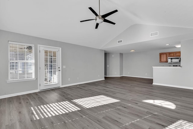 unfurnished living room featuring ceiling fan, high vaulted ceiling, and light hardwood / wood-style flooring