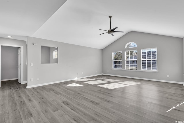 unfurnished living room with ceiling fan, light wood-type flooring, and lofted ceiling