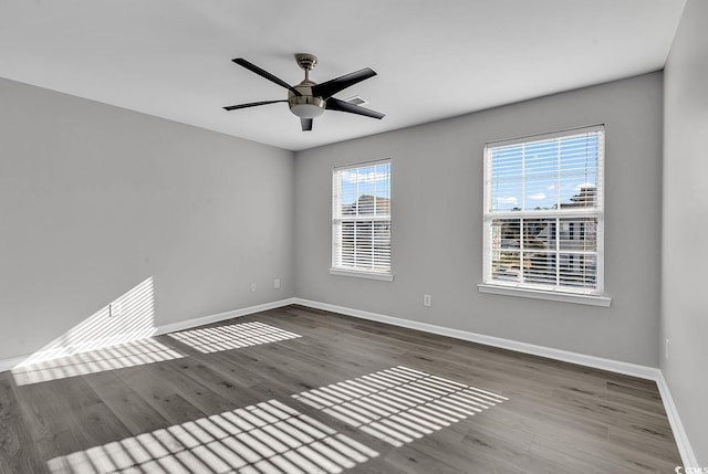 empty room featuring ceiling fan and wood-type flooring