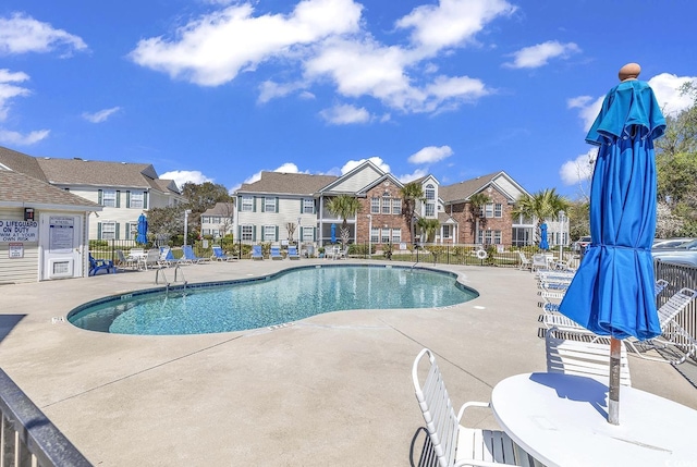 view of swimming pool with a patio area