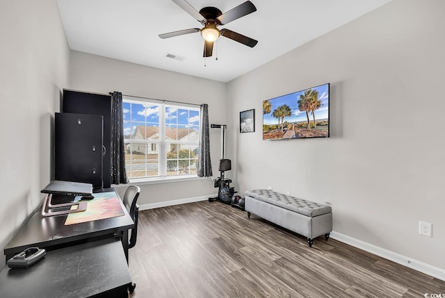 home office featuring ceiling fan and hardwood / wood-style flooring