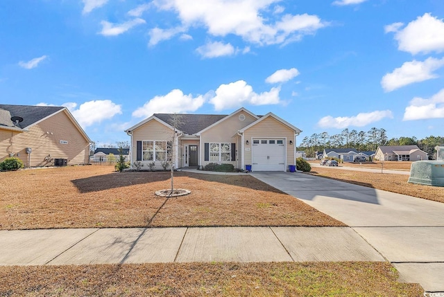 view of front of home featuring a garage and cooling unit