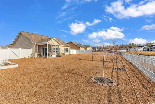 view of yard featuring a sunroom