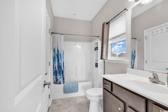 full bathroom with tile patterned floors, vanity, shower / bath combo, and toilet