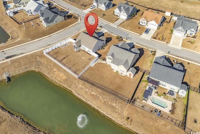 birds eye view of property featuring a water view