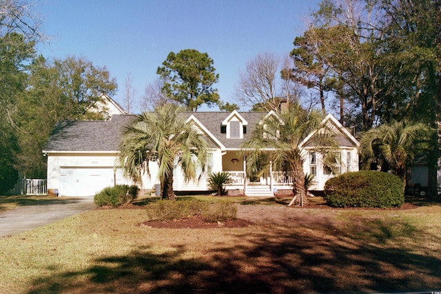 view of front of home with covered porch and a garage