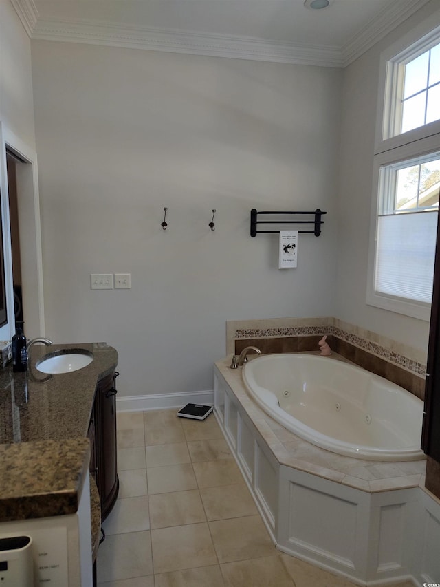 bathroom featuring a whirlpool tub, tile patterned flooring, baseboards, and crown molding