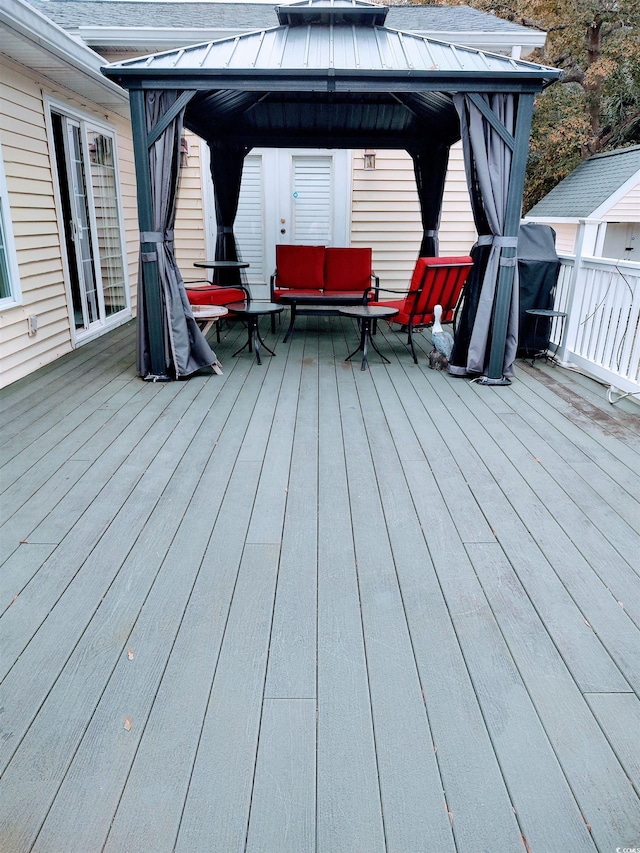 wooden deck featuring a gazebo