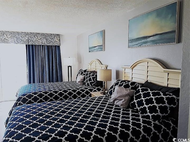 bedroom featuring a textured ceiling