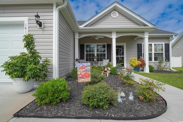 141 Baylee Cir, Galivants Ferry, SC 29544 - view of exterior entry featuring a porch, a garage, and ceiling fan