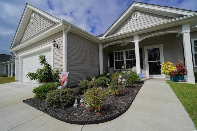 exterior space featuring a porch and a garage