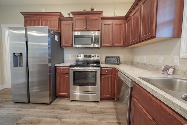 141 Baylee Cir, Galivants Ferry, SC 29544 - kitchen featuring appliances with stainless steel finishes, light countertops, and light wood-style floors