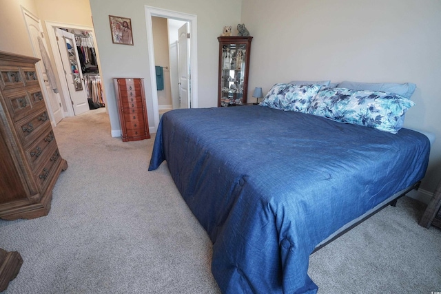 141 Baylee Cir, Galivants Ferry, SC 29544 - bedroom with light carpet, a walk in closet, baseboards, a closet, and connected bathroom