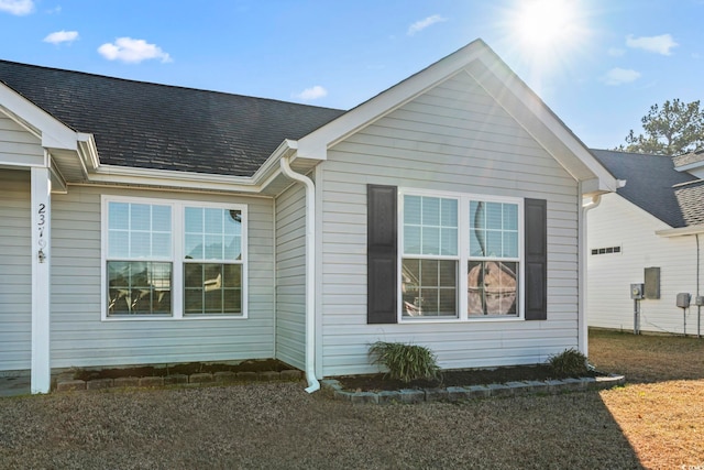 view of home's exterior with a yard