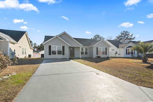 ranch-style home featuring a front yard and cooling unit