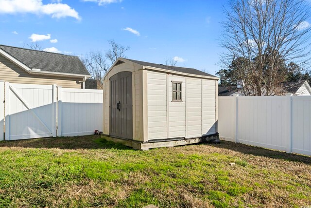 view of outbuilding with a lawn