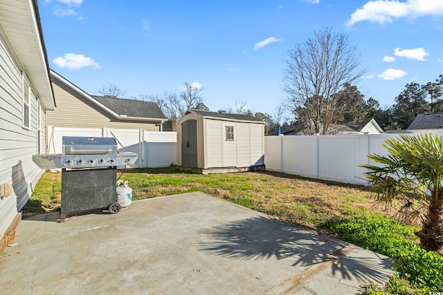 view of patio featuring a shed and grilling area