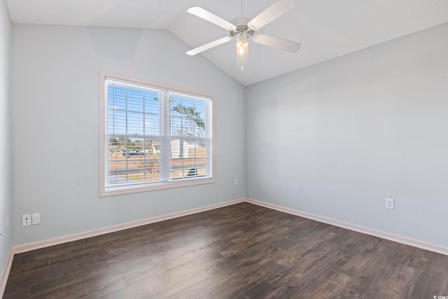 empty room with vaulted ceiling, ceiling fan, and dark hardwood / wood-style flooring