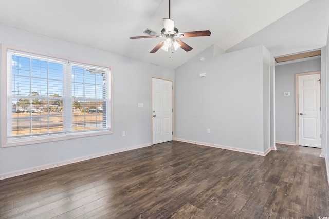 empty room with ceiling fan, dark hardwood / wood-style floors, and vaulted ceiling