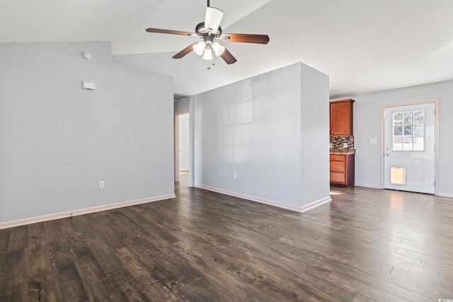 unfurnished living room with ceiling fan and dark hardwood / wood-style floors