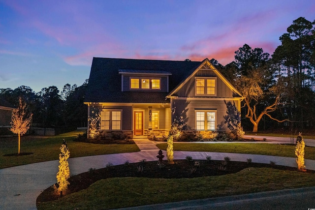 view of front of home with a lawn