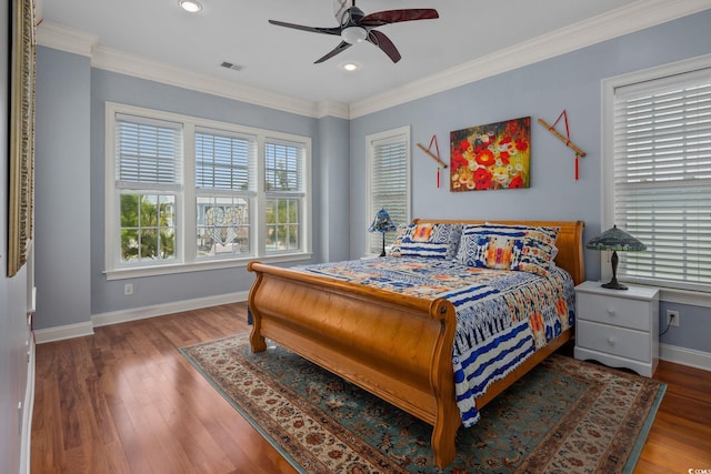 bedroom featuring ornamental molding, hardwood / wood-style floors, and ceiling fan