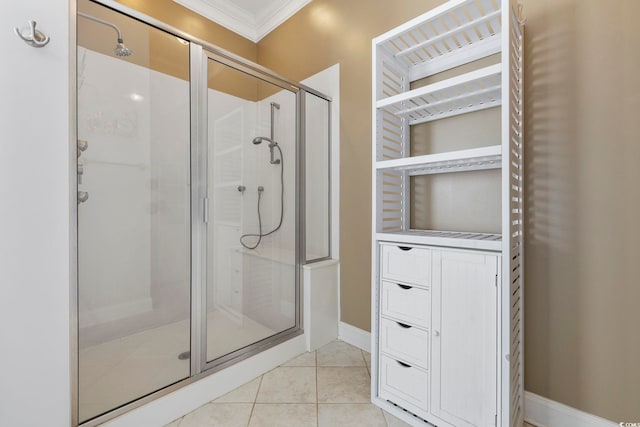 bathroom featuring tile patterned flooring, crown molding, and walk in shower