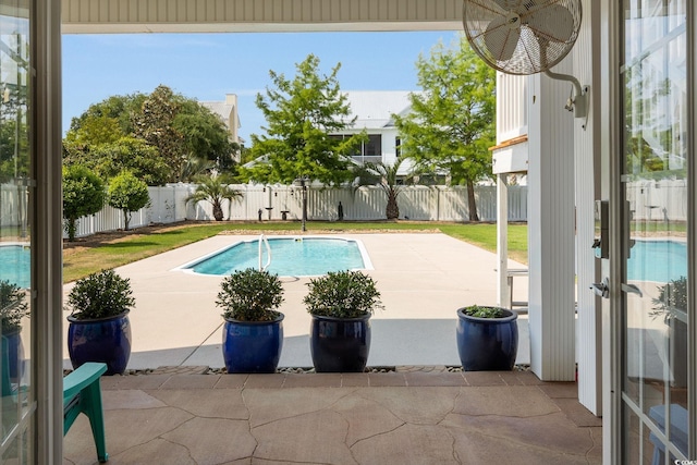 view of swimming pool featuring a patio area