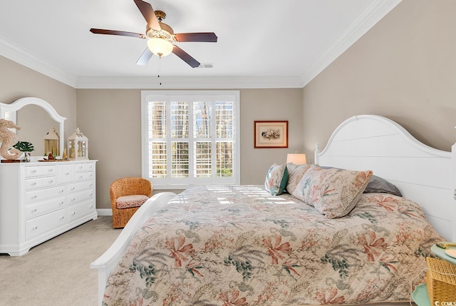 carpeted bedroom with crown molding and ceiling fan