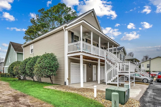 view of front of property with ceiling fan and a garage