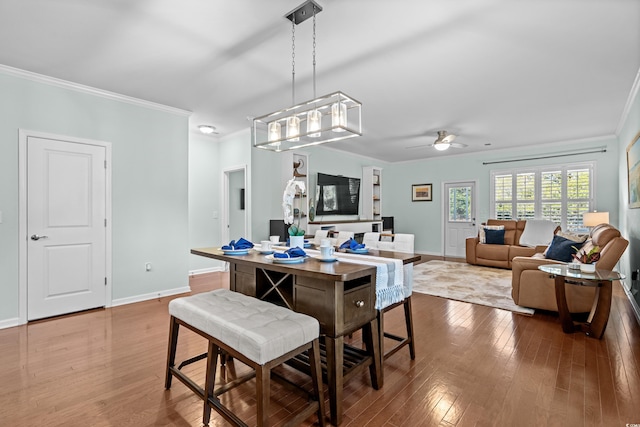 3716 Mackevans Ct, Myrtle Beach, SC 29579 - dining space featuring ornamental molding, hardwood / wood-style floors, ceiling fan, and baseboards