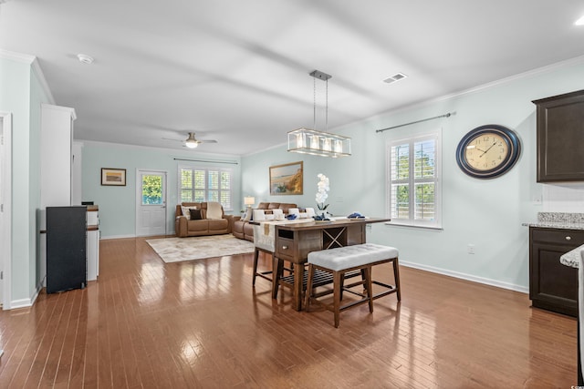 3716 Mackevans Ct, Myrtle Beach, SC 29579 - dining room with ornamental molding, baseboards, dark wood-style floors, and a ceiling fan