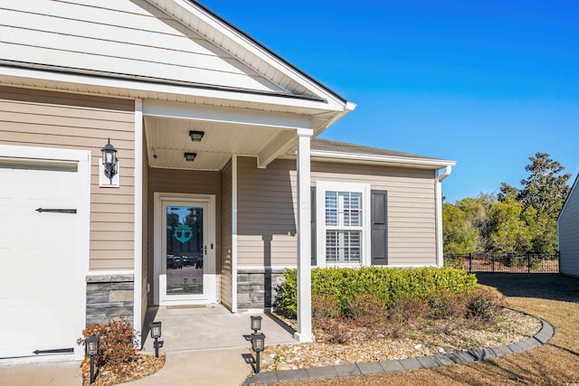 3716 Mackevans Ct, Myrtle Beach, SC 29579 - entrance to property featuring fence, stone siding, and a porch