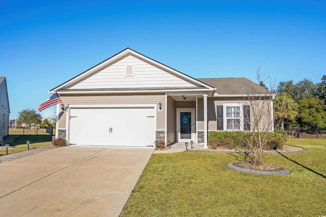 view of front of house featuring a garage and a front lawn