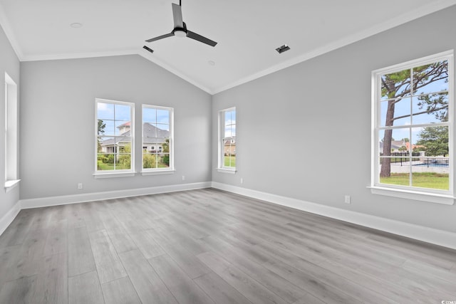 spare room featuring ceiling fan, light hardwood / wood-style floors, lofted ceiling, and crown molding