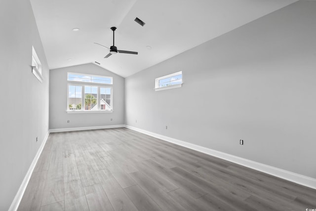 unfurnished room with ceiling fan, wood-type flooring, and vaulted ceiling