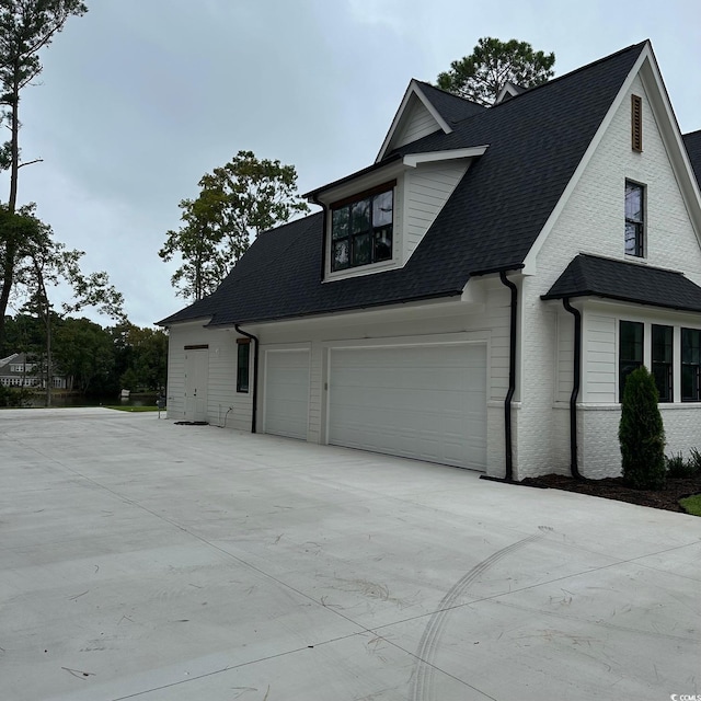 view of side of home with a garage