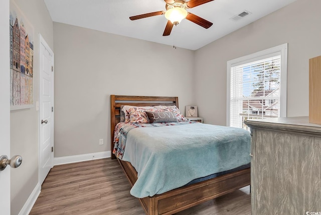 bedroom featuring hardwood / wood-style floors and ceiling fan