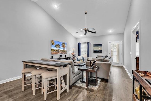 interior space featuring ceiling fan, dark hardwood / wood-style flooring, and high vaulted ceiling