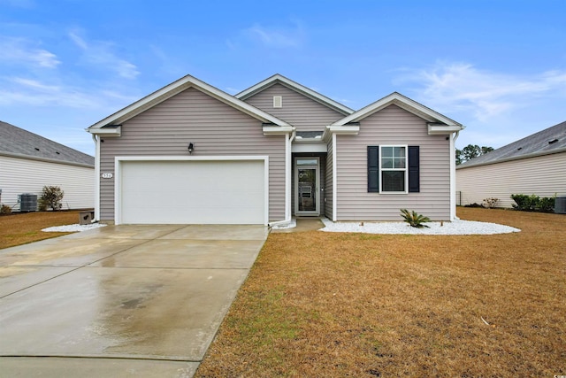 view of front of house featuring central AC, a garage, and a front lawn